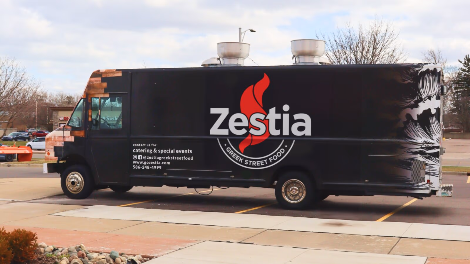 The Zestia food truck parked and serving at an event